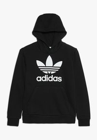 Mustmustöör musta kapuutsiga, millel on valge Adidas logo ja kolm triipu. Omab eesmist kanaga kotitaskut ja soonikserva.