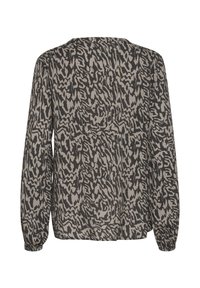 Blouse à manches longues en tissu texturé avec un motif abstrait noir et beige. Dotée d'un décolleté rond et de poignets élastiques.