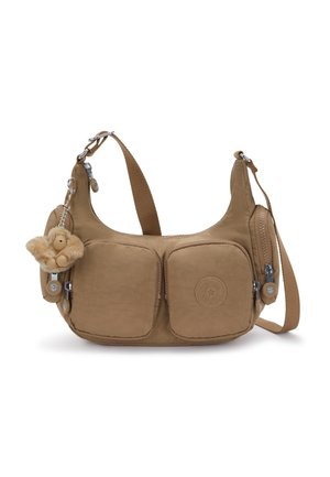 Brown crossbody bag with multiple zippered pockets and a small plush monkey keychain attached to the left side.