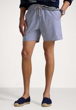Blue and white striped swim shorts with an elastic waistband and drawstring, featuring a small embroidered logo on the side.