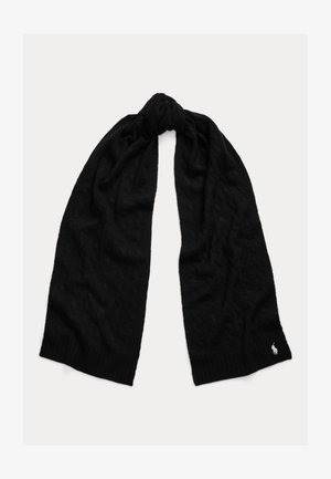 Écharpe noire tricotée avec motif torsadé, nouée de manière lâche au centre, avec un petit logo blanc brodé à une extrémité.