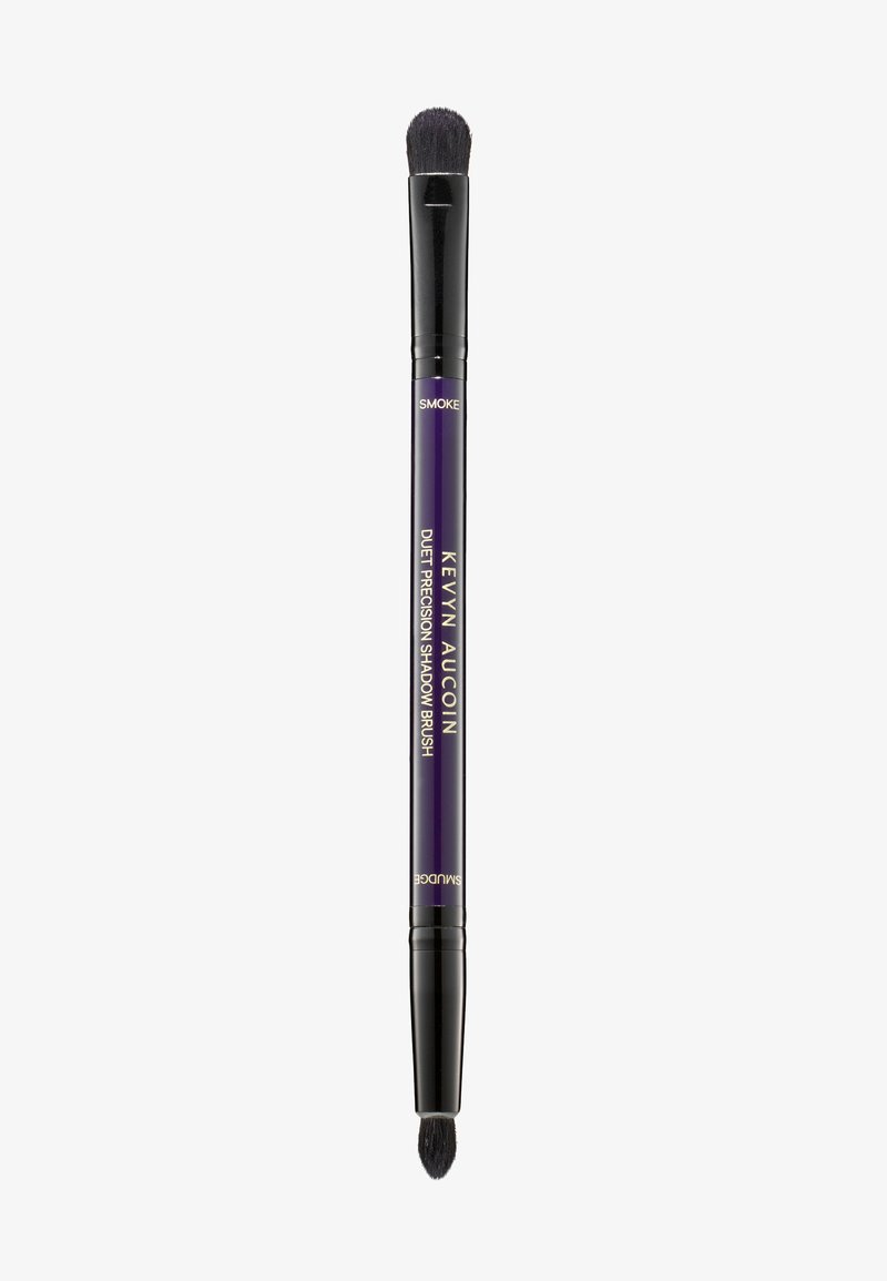 Duet precision shadow brush with dual-ended design. Black bristles, purple handle with gold lettering, tapered shape for precise application.