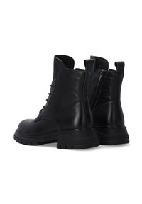 Schwarze Leder-Stiefeletten mit runder Zehenpartie, Schnürung an der Vorderseite und seitlichem Reißverschluss. Klobige Sohle mit strukturierten Details und Schlaufen an der Kragenkante.