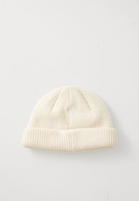 Cream-colored knitted beanie hat with folded edge, displayed flat on a white background.