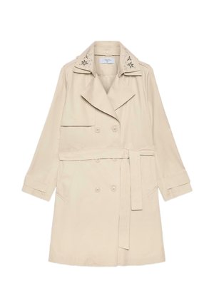 Trench-coat beige croisé à ceinture avec broderie florale sur le col, doté de manches longues et de poches latérales.