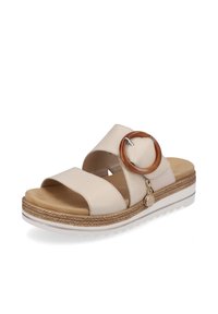 Beige Leder-Sandale mit zwei breiten Riemen, einem runden braunen Akzent und einer strukturierten Zwischensohle. Sie verfügt über eine weiße Außensohle mit einem leichten Keil.