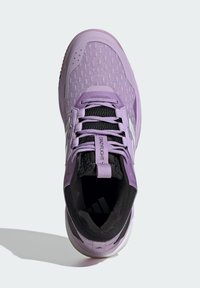 Purple athletic shoe with a textured mesh upper, black accents, prominent laces, and a cushioned sole. Includes a label reading "CrazyFlight."