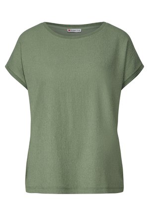 T-shirt verde a maniche corte realizzato in tessuto testurizzato, con scollo rotondo e una vestibilità rilassata con risvolti sulle maniche.
