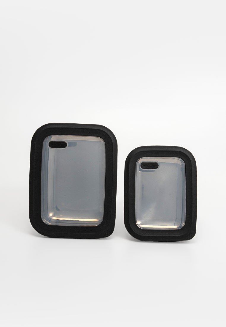Two rectangular containers with black rubber edges and transparent plastic bodies, one larger and one smaller, both featuring rounded corners.