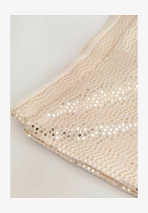 Beidzēts audums ar acs rakstu, kas dekorēts ar spīdīgām apaļām pūkām. Malas ir apstrādātas ar gludu, viendabīgu auduma apdari.