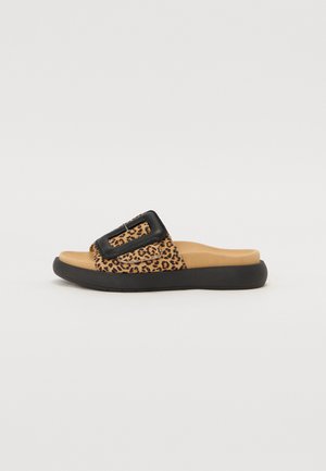 Leopard print slide sandal with a black oversized buckle, tan cushioned footbed, and a black rubber sole, featuring a textured design.