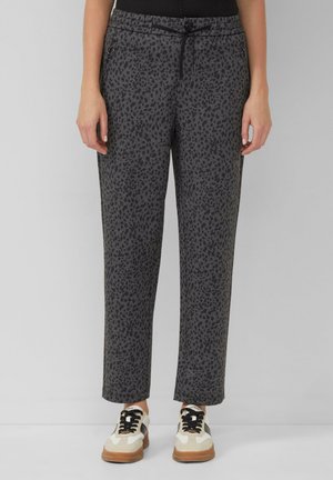 MIT REISSVERSCHLUSSTASCHEN UND ALL-OVER-PRINT - Pantaloni - schwarz