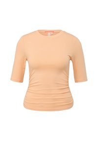 Pfirsichfarbene Kurzarm-T-Shirt mit rundem Ausschnitt, gerafftem Seitendetail und weicher, glatter Textur. Keine sichtbaren Logos oder Muster.