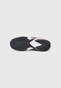 Black rubber shoe sole with a textured pattern, white midsole, and red accent, featuring a logo and sleek geometric shapes.