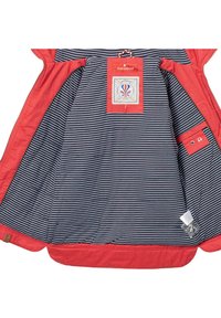 Red outer fabric jacket with a navy striped inner lining. Features a label, snap button pocket, and smooth textile texture.