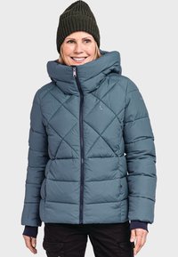 Eingepolsterte Jacke in Teal mit Rautenmuster, hohem Kragen und Reißverschluss. Verfügt über gerippte Bündchen und ein Logo am Ärmel.