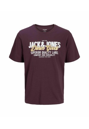 T-shirt in cotone color mogano con scollo rotondo e maniche corte. La parte anteriore presenta un testo audace in bianco e giallo con grafica che promuove il marchio.