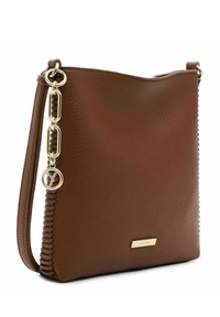 Brown leather crossbody bag featuring a textured surface, gold hardware, braided side detail, and a logo plate accent.