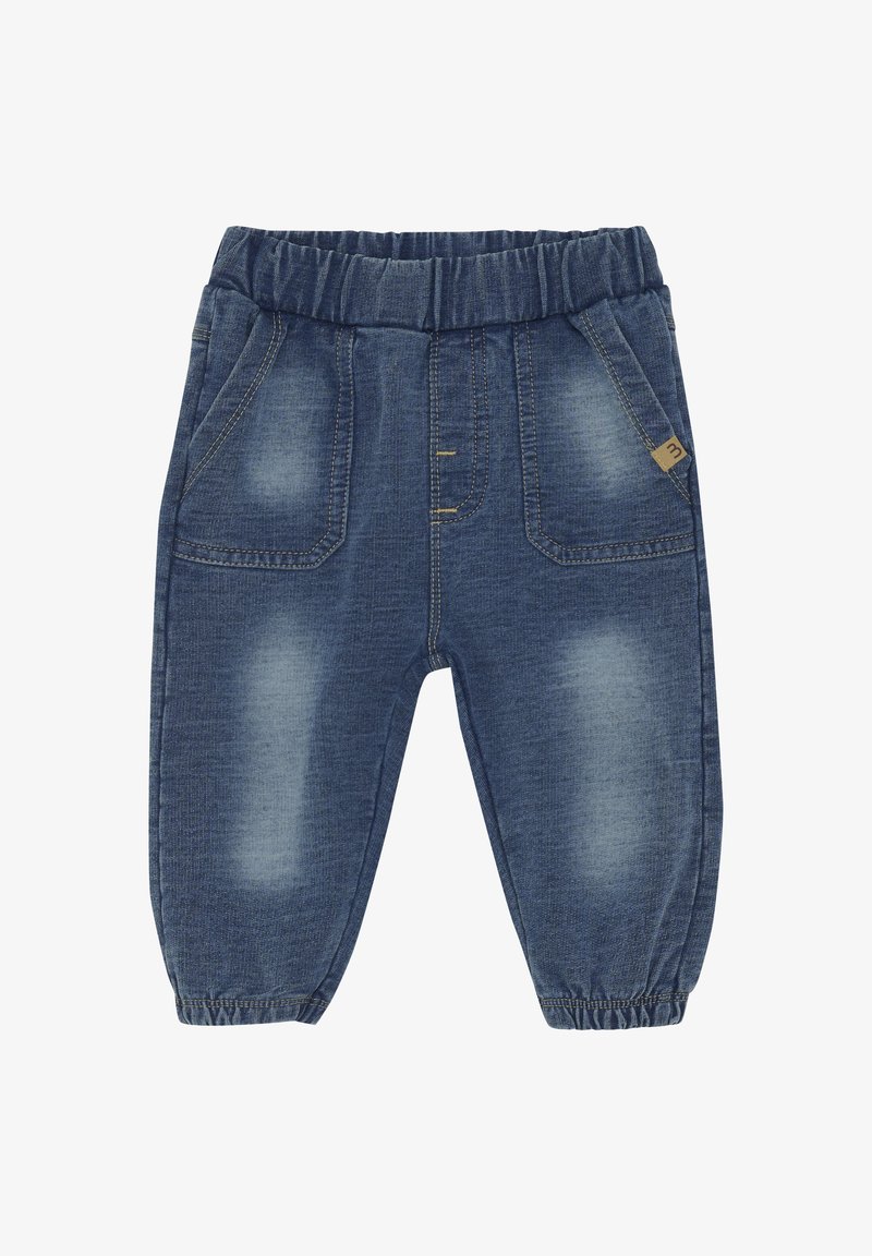 Jeans med elastisk midja, ljusblå tvätt, framfickor och samlade muddar. Har subtila blekningar och gula sömdetaljer.