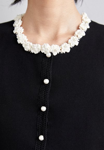 sandro CARDIGAN SANS MANCHE DETAIL GIRLY - Brezrokavnik - noir