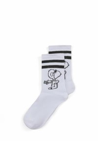 Weiße Baumwollsocken mit schwarzen Streifen oben, mit einem Snoopy-Graphic an der Seite. Gerippte Textur.