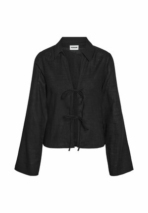 Mustast linast pika varrukaga pluus krae, avatava eesosa ja kaks eesmist lipsu sulgemiseks.