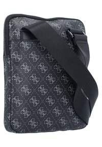 Black crossbody bag made of textured synthetic material, featuring a repeated logo pattern, zip closure, and adjustable strap.