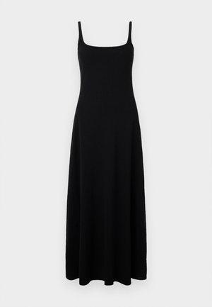 Zwarte maxi-jurk met een getailleerde bovenkant, vierkante halslijn en dunne bandjes. Gemaakt van een soepele, elastische stof die tot de enkels valt.
