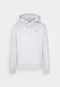 Sudadera con capucha gris con bolsillo frontal, capucha con cordón y puños acanalados. Pequeño logo en el pecho. Fabricada con un material suave y texturizado.