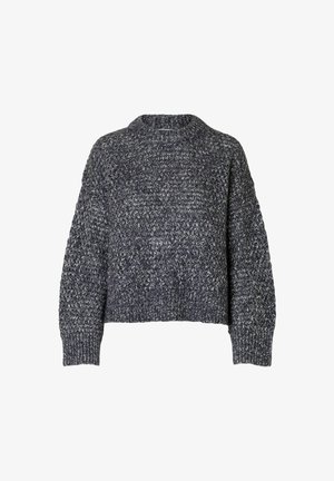 Tamsiai pilkos spalvos storos tekstūros megztinis su šviesiai pilkais akcentais. Yra aukštas apykaklės kirpimas, pakelti pečiai ir elastingi rankogaliai bei apačia.