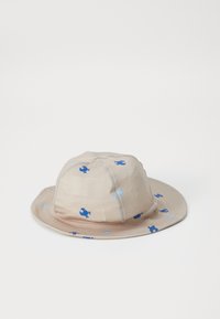 Beige bucket-hatt i tyg, med ett lekfullt blåkrabba-mönster, bred skärm och sydda detaljer för struktur.