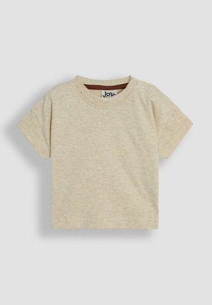 Korte mouwen, lichtbeige t-shirt van een zachte stof, met een ronde halslijn en twee drukknoopjes op de schouder voor gemakkelijk aan- en uittrekken.
