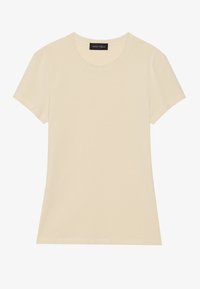 Cream short-sleeve t-shirt with a round neckline. Made from soft fabric, it features clean stitching and a fitted shape. Brand label visible.