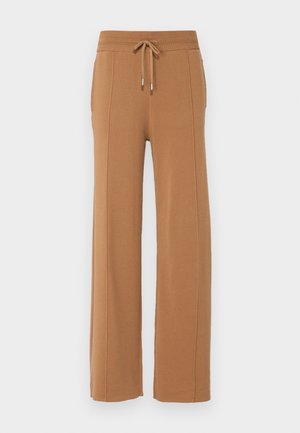 Pantaloni larghi marroni realizzati in un morbido tessuto testurizzato. Presentano una vita elastica con coulisse e tasche laterali.