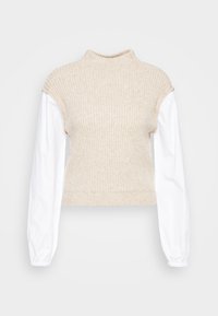 Beige svetr s ribovaným vzorem a vysokým límcem, s bílými balónovými rukávy, v cropped designu a jemnou texturou.