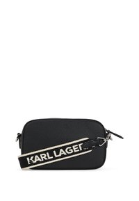 Black textured crossbody bag with a rectangular shape. Features a white branded strap and silver hardware. Zipper closure on the top.