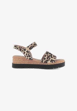 Wedge sandal with black and brown leopard print straps, cork-style midsole, and black rubber outsole, side view on white background.
