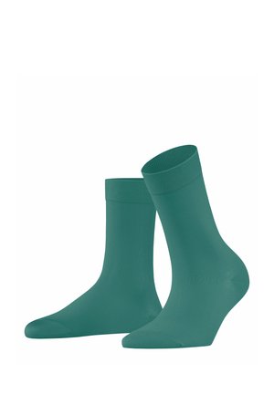 Türkise Baumwollsocken mit geripptem Bund; glatte Textur, knöchellang, nahtloser Zehenbereich und eine anliegende Passform für Komfort und Unterstützung.