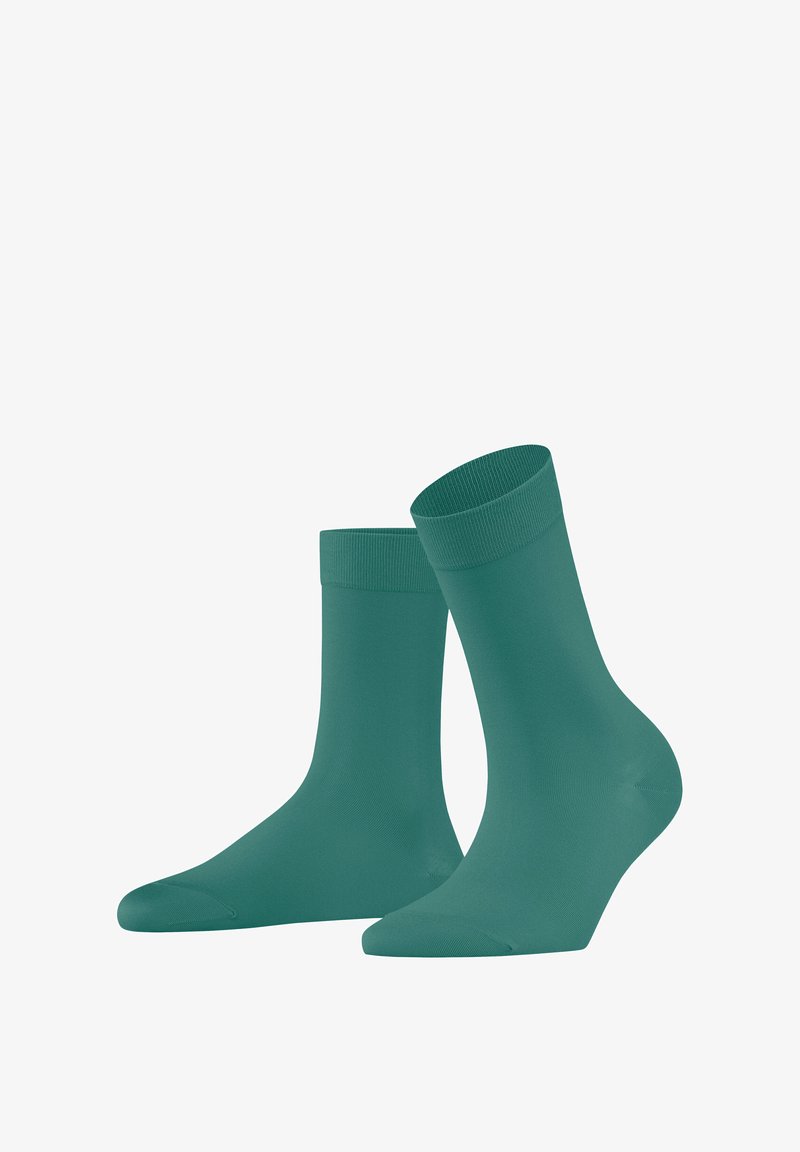 Teal cotton socks with a ribbed cuff; smooth texture, mid-calf length, seamless toe, and a fitted design for comfort and support.