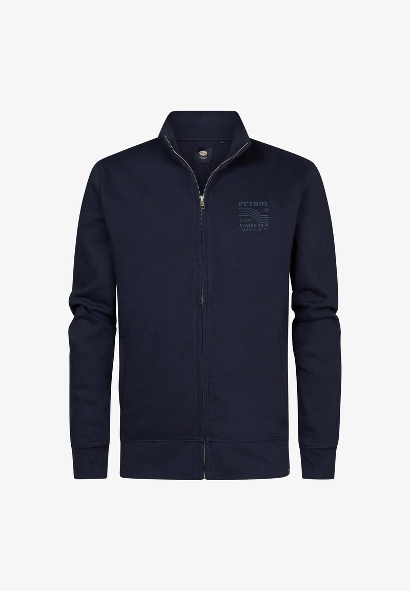 Sudadera de cremallera en color navy, hecha de un tejido suave, que presenta un cuello alto, mangas largas, bolsillos laterales y un estampado de logo en el pecho.