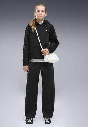 Puma, ESSENTIALS TAPE RELAXED JOGGINGHOSE - Verryttelyhousut - black