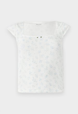 White floral-patterned top with short cap sleeves, ribbed texture, square neckline, and a small button accent at the center front.