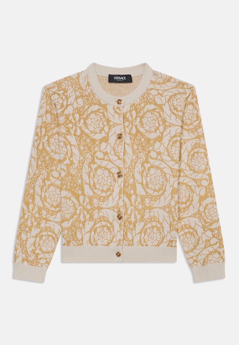 Cardigan beige con motivo floreale dorato, con polsini e orlo a coste, caratterizzato da scollatura rotonda e chiusura con sei bottoni dorati. Etichetta del marchio Versace.
