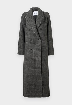 Cappotto lungo a quadri grigi realizzato in tessuto testurizzato. Presenta una chiusura doppiopetto con bottoni neri e rever a punte. Include tasche piatte.