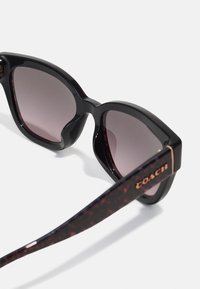 COACH Sunglasses - ruby pearl