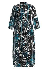 Maxiklänning i svart med vita och tealblommönster. Har en krage, långa ärmar och ett knyt i midjan för en definierad silhuett.