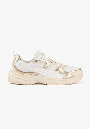 White and gold low-top sneaker with mesh and leather panels, lace-up design, thick sole, and subtle brand detailing on side and heel.