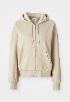 Beige vetoketjuhuppari, jossa on nyöritettävä huppu, kengurupocketit, ribbaushihansuut ja helma sekä pieni logo vasemmassa rinnassa. Pehmeä kangas.