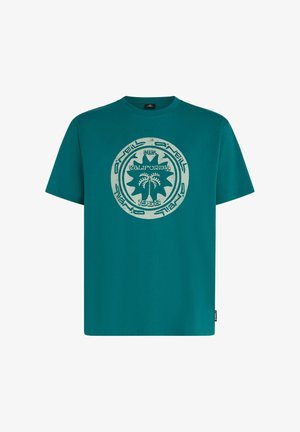 T-shirt di cotone color teal con grafica circolare usurata raffigurante palme e la scritta "California 1962." Maniche corte e vestibilità comoda.