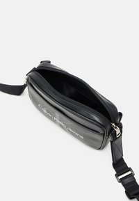 Calvin Klein Jeans MONOGRAM SOFT CAMERA BAG UNISEX - Cross body bag - black